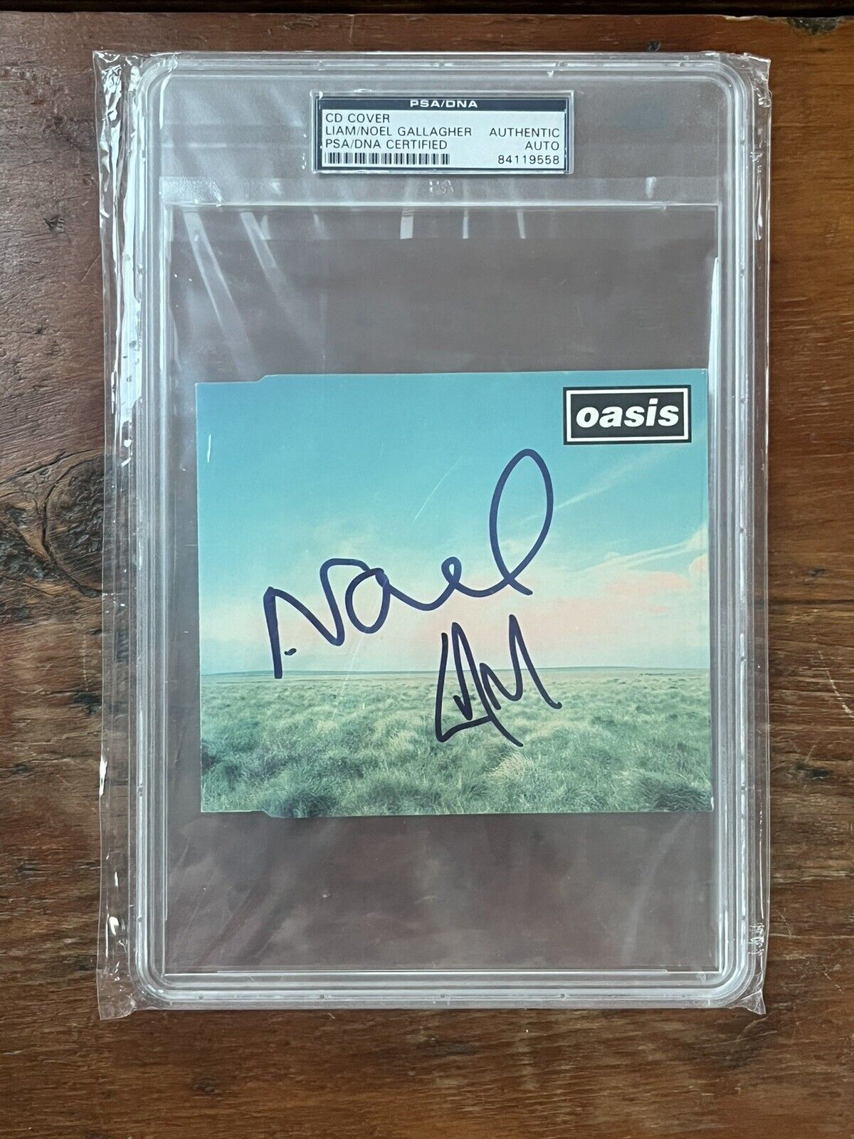 OASIS Noel + Liam Gallagher Signed CD Cover PSA