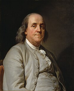 Portrait of Benjamin Franklin in formal attire against a dark background